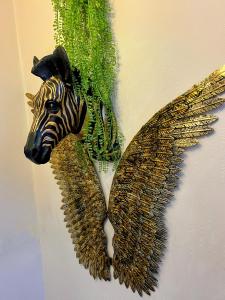 a statue of a zebra with an angel wing at Kelston Guest House in Weymouth