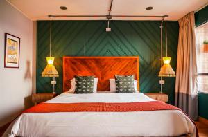 Una cama o camas en una habitación de Hotel Ilar 74