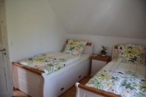 Ein Bett oder Betten in einem Zimmer der Unterkunft Boddenblick - Breege