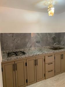 a kitchen with a sink and a counter top at Nomad Surf Lodge in Imsouane +187 photos