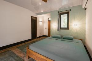 Postel nebo postele na pokoji v ubytování Susi's Suites