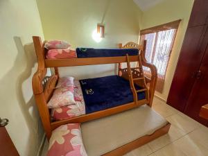a bedroom with two bunk beds in a room at Casa Vacacional de Playa Vip in Tucacas +27 photos
