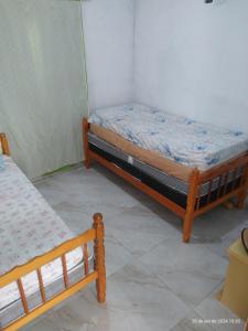 Ένα ή περισσότερα κρεβάτια σε δωμάτιο στο Spacious house in Mongagua 5x5 pool