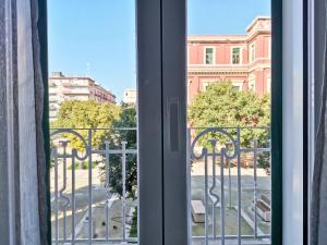 a window with a view of a building at L'altro Krisà in Bari