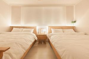 Postel nebo postele na pokoji v ubytování Nldam stay Seoul stn 8min Hongdae 1stop Dongdaemun Myeongdong Gangnam홍대입구1정거장 동대문,명동,강남 인접