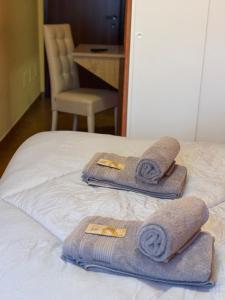 Postel nebo postele na pokoji v ubytování Albergo Baffo