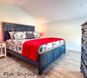 a bedroom with a large bed and a dresser at Fish Stories 5 Bed 3 Bath With Pool and Playscape in Port O'Connor +22 photos