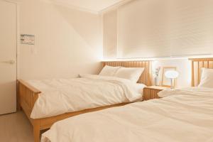 Postel nebo postele na pokoji v ubytování Nldam stay Seoul stn 8min Hongdae 1stop Dongdaemun Myeongdong Gangnam홍대입구1정거장 동대문,명동,강남 인접