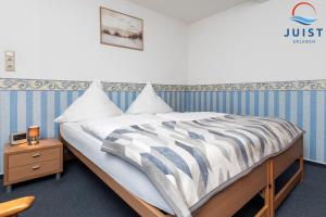 En eller flere senge i et værelse på Töwerland Zimmer 5