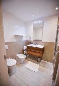 Ένα μπάνιο στο Laguna Palace Resort appartamento con una camera