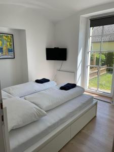 Postel nebo postele na pokoji v ubytování Rosenvilla Velden