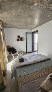 Letto o letti in una camera di Serene Escape in Porto Madeira