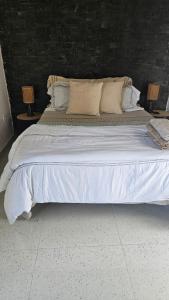 Letto o letti in una camera di Serene Escape in Porto Madeira
