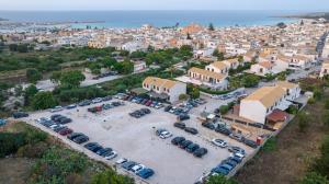 an aerial view of a parking lot in front of a city at Daphne B&B in San Vito lo Capo