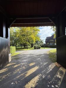 an empty road in a building with trees in the background at Résidence Le Royal Panorama - Deauville in Deauville
