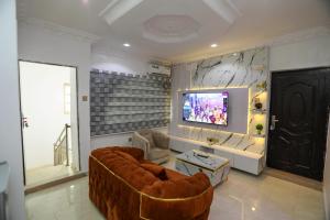 Televisyen dan/atau pusat hiburan di Grace On Wallstreet Apartments