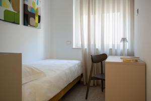 Postel nebo postele na pokoji v ubytování Palazzo Indaco