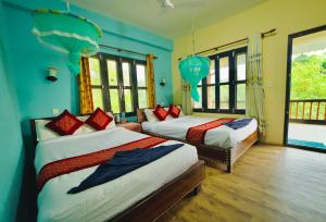 Voodi või voodid majutusasutuse Chitwan Gaida Lodge - Animal Lovers & Birdwatchers Paradise toas