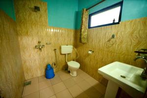 Vannituba majutusasutuses Chitwan Gaida Lodge - Animal Lovers & Birdwatchers Paradise