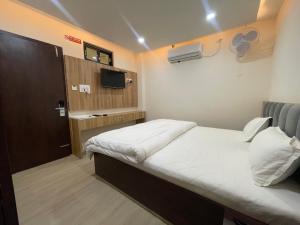 Voodi või voodid majutusasutuse Hotel Faben Inn toas