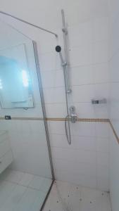 a shower with a glass door in a bathroom at apt via cernaia rome center in Rome