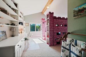 a childs room with pink and green walls at Warm Mountain Escape Secluded Peaceful Hot Tub in Bordenville +97 photos