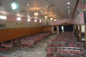 a room with rows of chairs in a building at Hotel Naveen Residency in Darbhanga