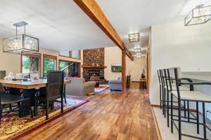 a dining room and living room with a table and chairs at Spacious Keystone Family Escape Great Location in Keystone