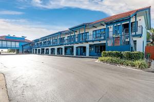 an empty parking lot in front of a building at Beachside Inn in Destin