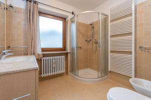 a bathroom with a shower and a sink at Casa Erica in Falcade +15 photos