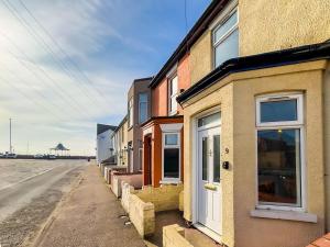 a building on the side of a street at Pavilion - Beachfront Property in Gorleston-on-Sea