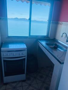 Η κουζίνα ή μικρή κουζίνα στο Castelinho de ibicui flats