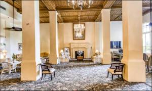 a large lobby with chairs and a chandelier at Palm Beach Modern Condo-Beach Attractions Nearby in Palm Beach