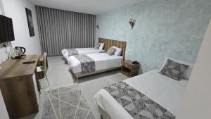 Ένα ή περισσότερα κρεβάτια σε δωμάτιο στο Jerusalem View Hotel