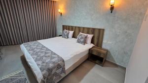 Ένα ή περισσότερα κρεβάτια σε δωμάτιο στο Jerusalem View Hotel