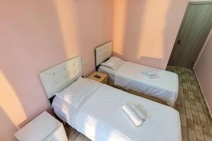 Postel nebo postele na pokoji v ubytování Hotel Ponto Vechio + 12 fotografií
