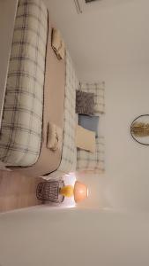 a room with a couch and pillows on the wall at Maison spacieuse in Saint-Julien-de-Concelles +27 photos
