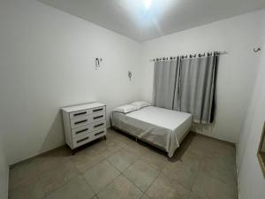 Ein Bett oder Betten in einem Zimmer der Unterkunft Casa Simões