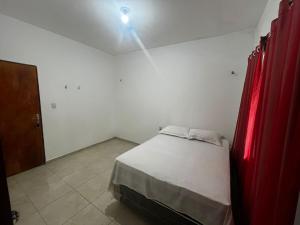 Ein Bett oder Betten in einem Zimmer der Unterkunft Casa Simões