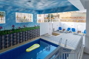 a swimming pool in a house with a swimming pool at Pharaohs Guest House in Luxor