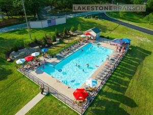 an overhead view of a swimming pool with people and umbrellas at Lodge 17 in Branson