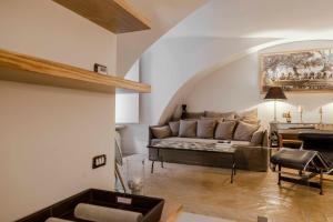 a living room with a couch and a table at Piazza Navona Luxury Loft in Rome +16 photos