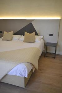 Postel nebo postele na pokoji v ubytování Hotel Torino
