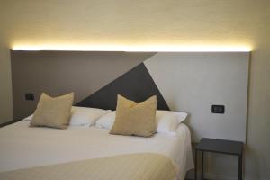 Postel nebo postele na pokoji v ubytování Hotel Torino