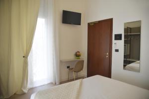 TV a/nebo společenská místnost v ubytování Hotel Torino