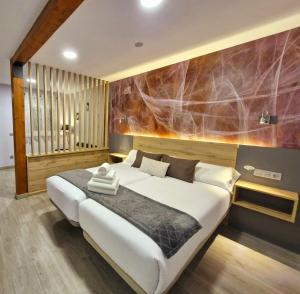 Postel nebo postele na pokoji v ubytování Feeling Home - Suites&Rooms