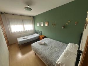 Postel nebo postele na pokoji v ubytování Peñas de Aia