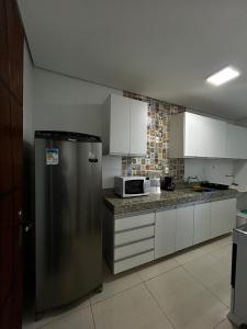 Kuchyň nebo kuchyňský kout v ubytování Apartamento 102