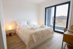 Ένα ή περισσότερα κρεβάτια σε δωμάτιο στο Holiday Home Oasis for You with Heated Pool