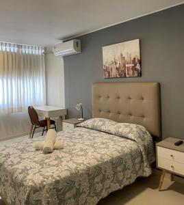 Postel nebo postele na pokoji v ubytování Casa Las Flores Ica